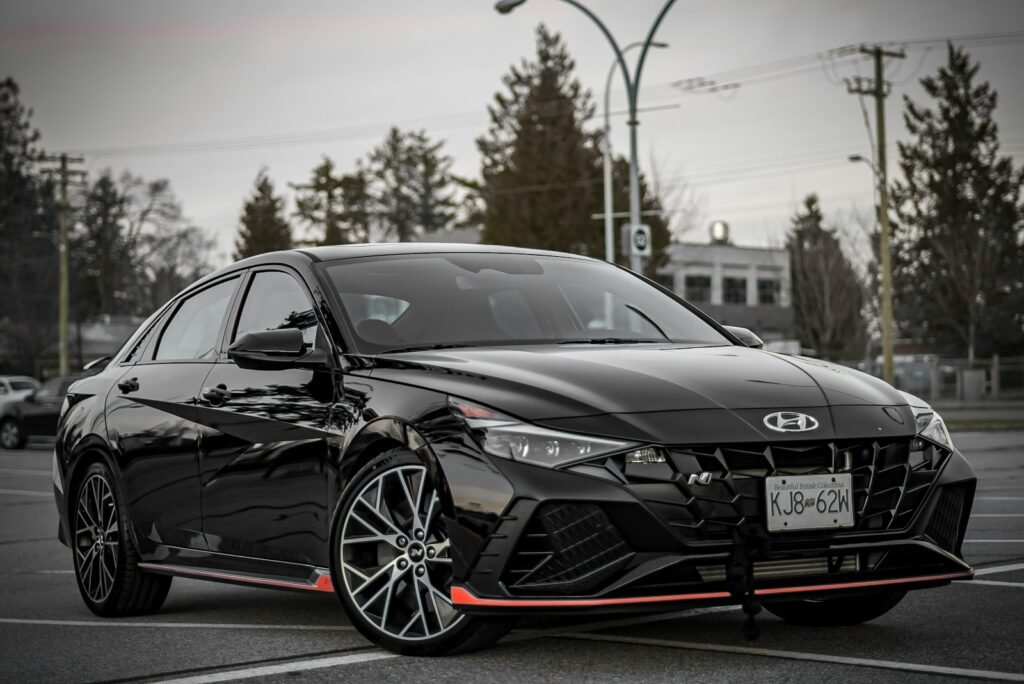 a black car parked in a parking lot